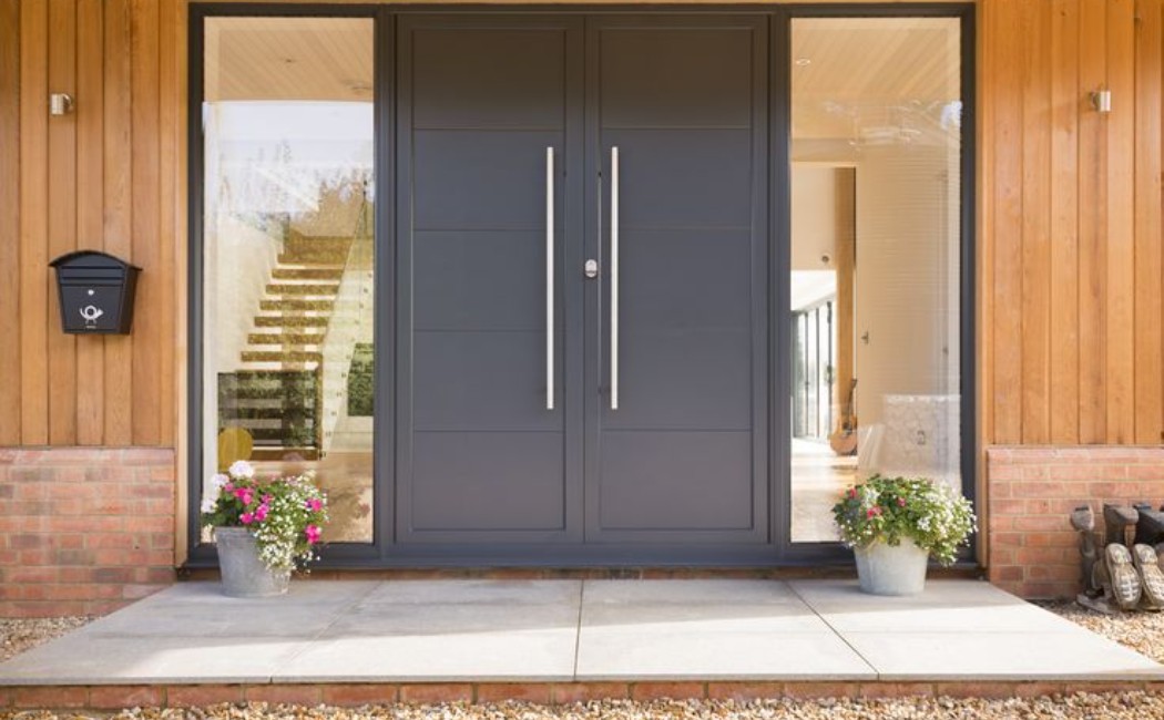 Modern front entry featuring sleek double doors showcasing expert residential door installation for a stylish and secure home entrance.