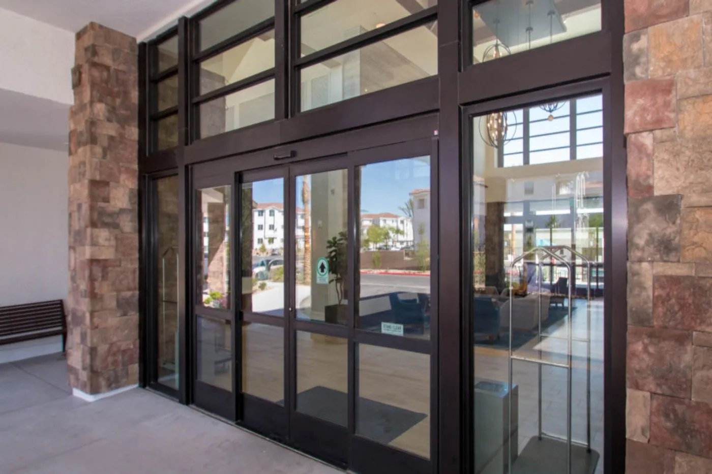 Professional Commercial Door Installation featuring modern automatic glass entry doors with durable aluminum framing for a secure and welcoming business entrance.