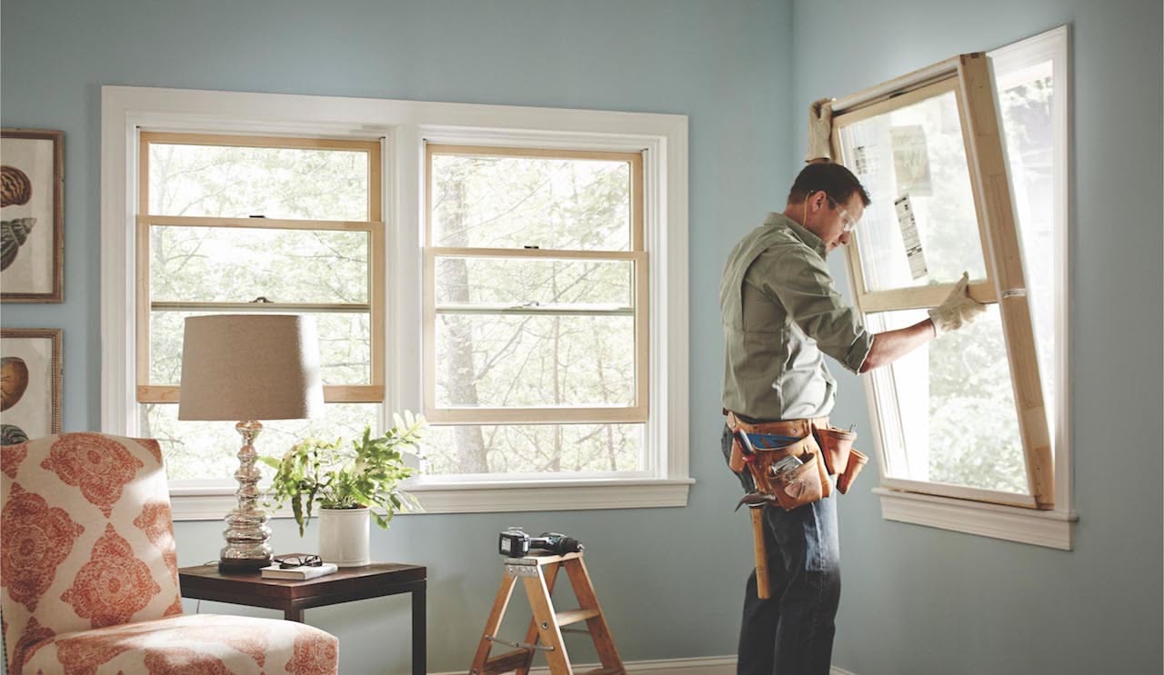 Custom Window Installation with a skilled professional fitting a new window for improved home comfort and style.