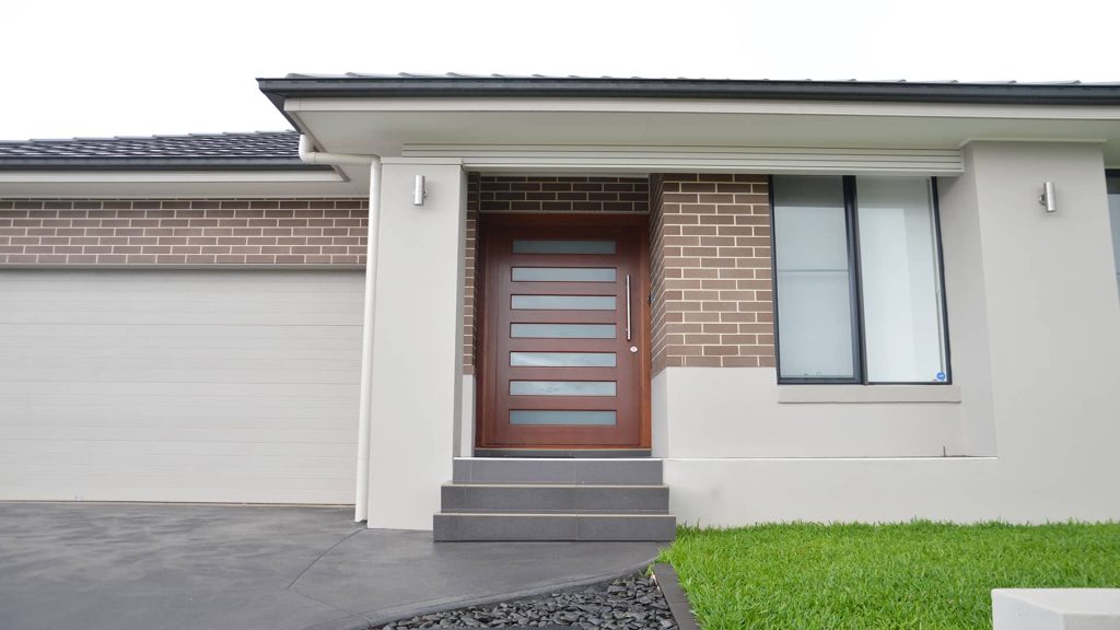 Door Installation Cost for a Modern Wooden Front Door with Glass Panels.