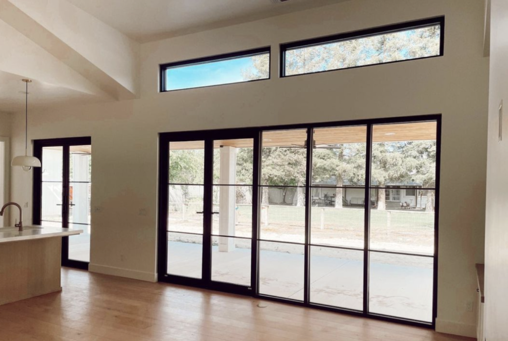 Large Patio Door Installation showcasing expansive glass doors that brighten and enhance a modern living space.