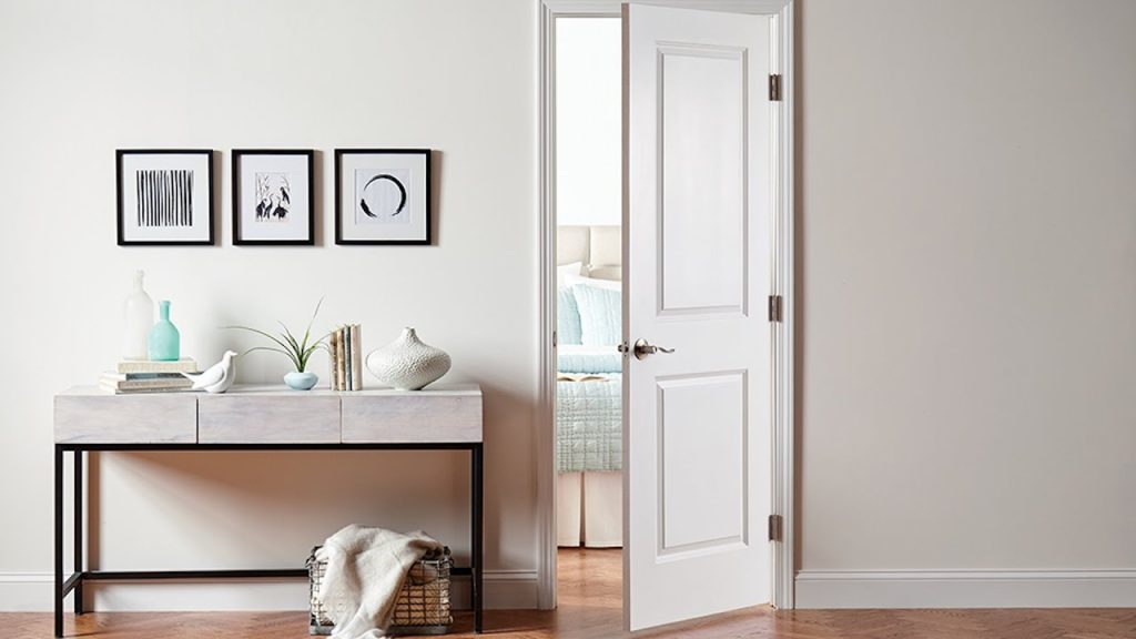 Residential Door Installation featuring a stylish white interior door, elegant entryway decor, and a bright, welcoming home design.