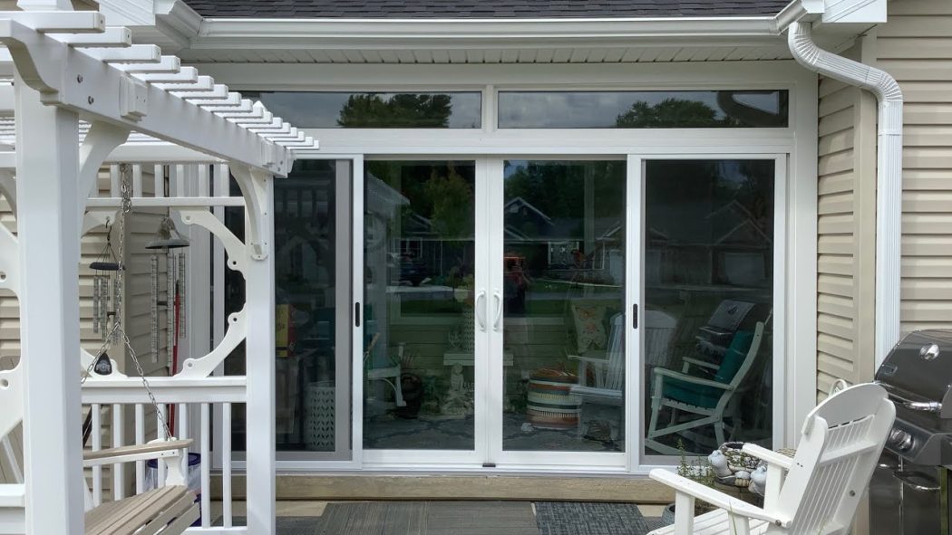 Patio Door Installation featuring elegant white sliding glass doors that brighten the outdoor living space.